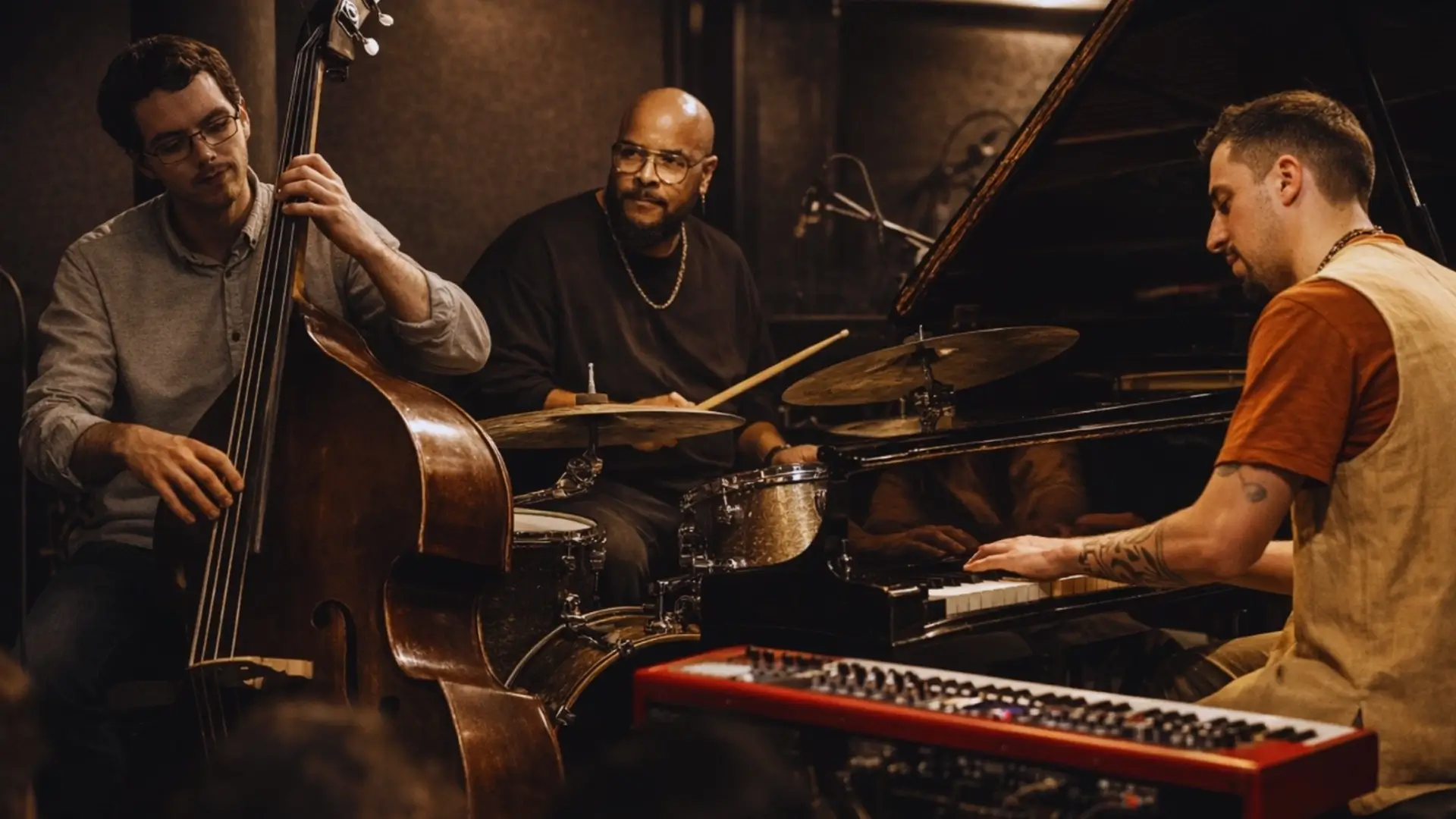A jazz trio performs live in an intimate club setting, featuring piano, double bass, and drums, surrounded by warm lighting.
