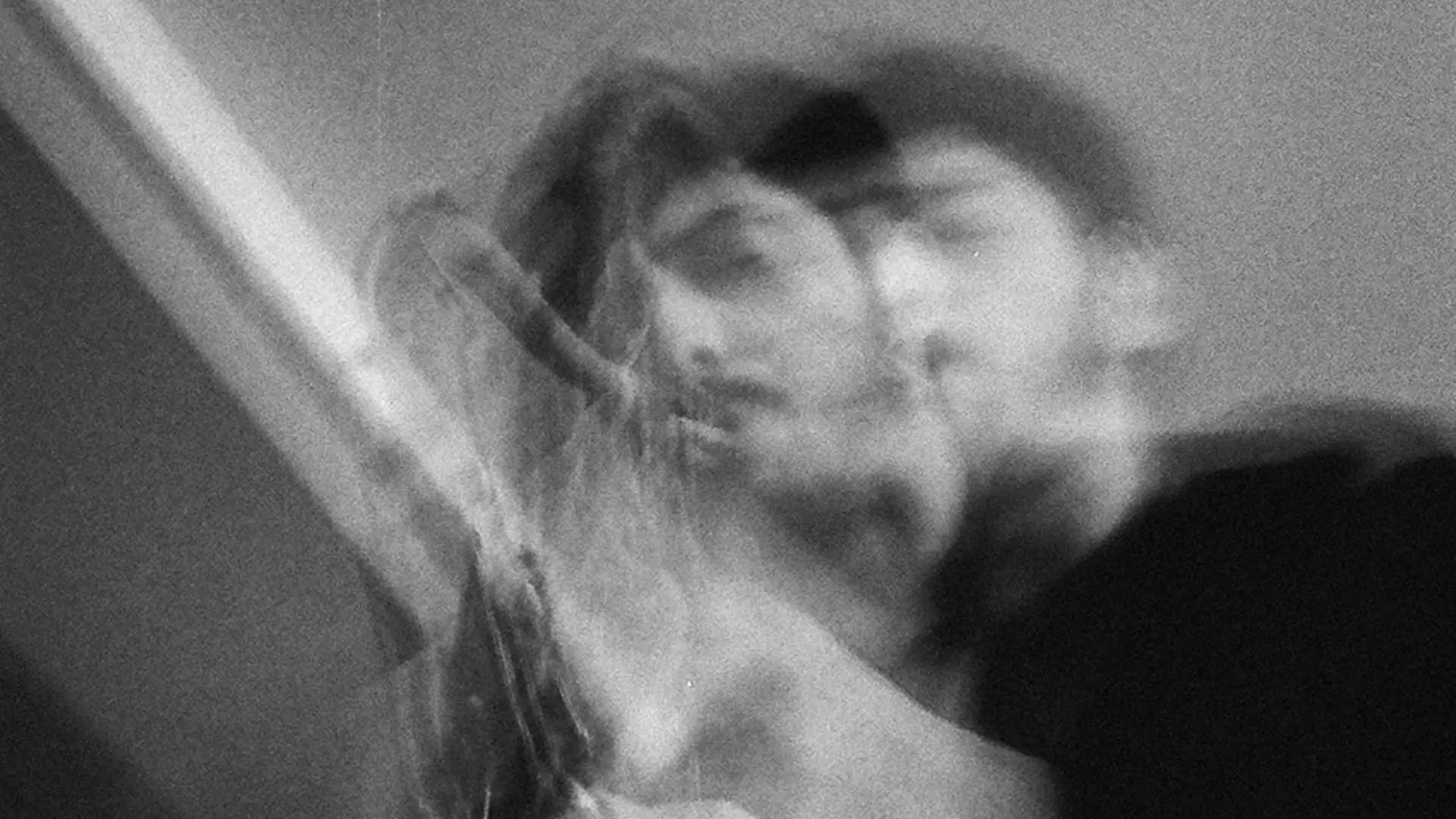 A saxophonist plays in an artistic black-and-white image with a blurred, double-exposure effect emphasizing movement and expression.